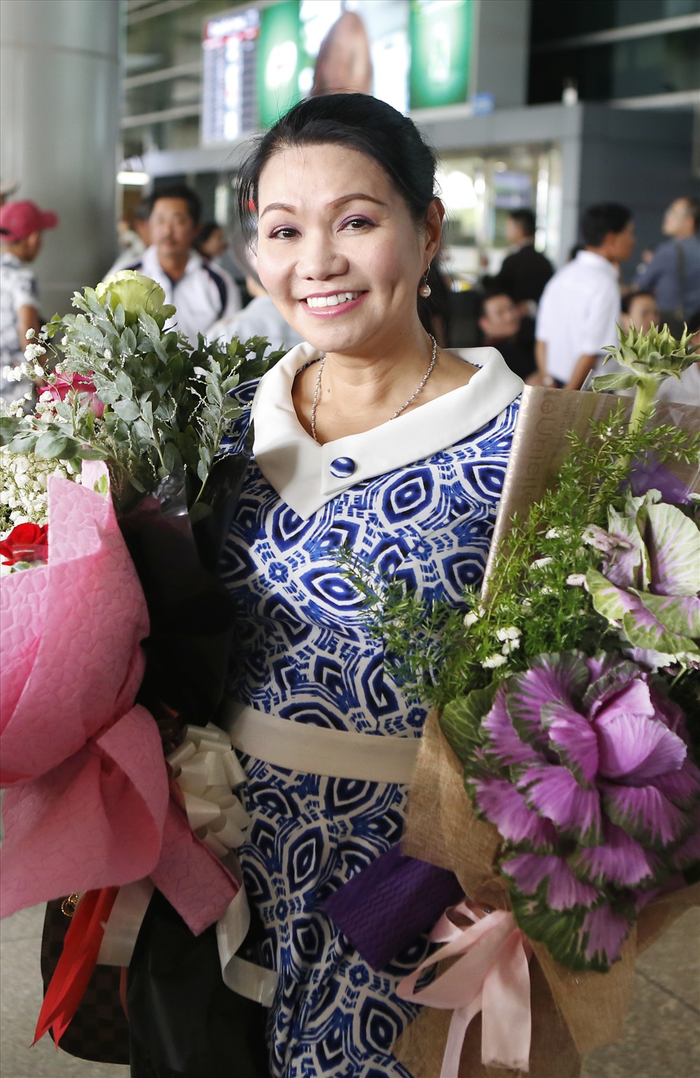 Ngọc Huyền tươi tắn ở sân bay. Ảnh: Quang Huy