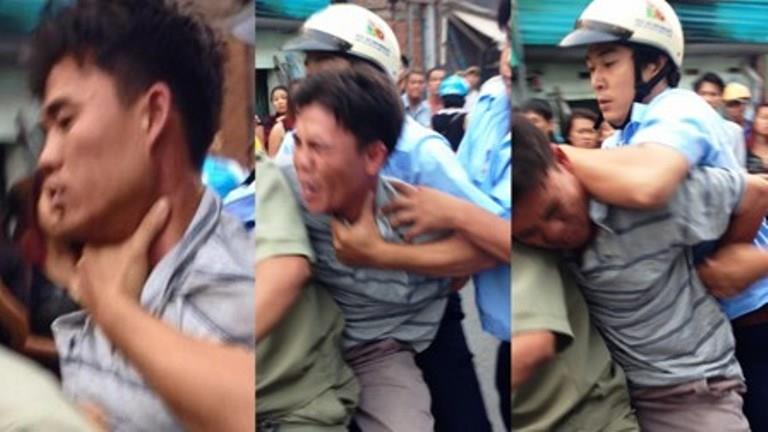 Khi anh Tình ngất xỉu, họ bỏ mặc nạn nhân nằm lê lết trên đường với 2 tay bị còng ra phía sau.