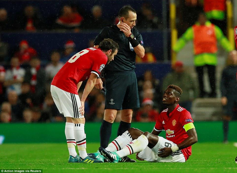 Pogba (phải) sẽ phải thi đấu tương đối dài sau chấn thương mới gặp phải. Ảnh: Getty Images.