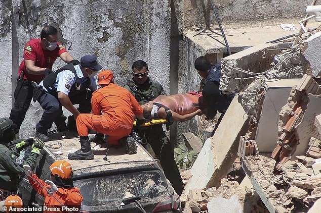 Một số hình ảnh tại hiện trường toà chung cư bị đổ. Ảnh: AP, AFP, Getty Images