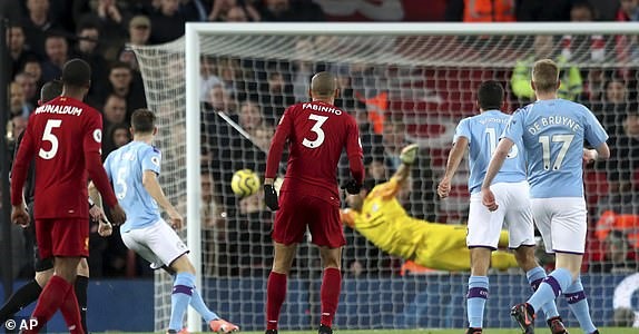 Fabinho mở tỉ số. Ảnh: Reuters & PA.