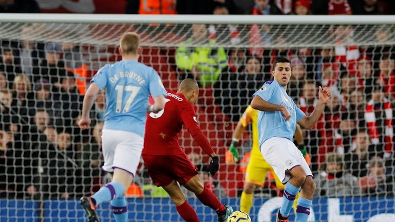 Fabinho mở tỉ số. Ảnh: Reuters & PA.