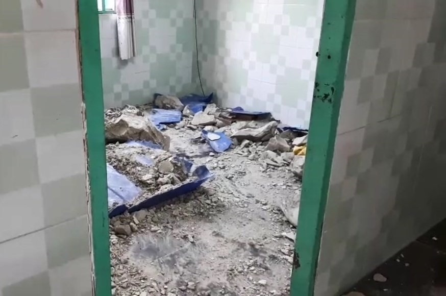 Một thi thể trong thùng nhựa đổ bê tông ở buồng của căn nhà.