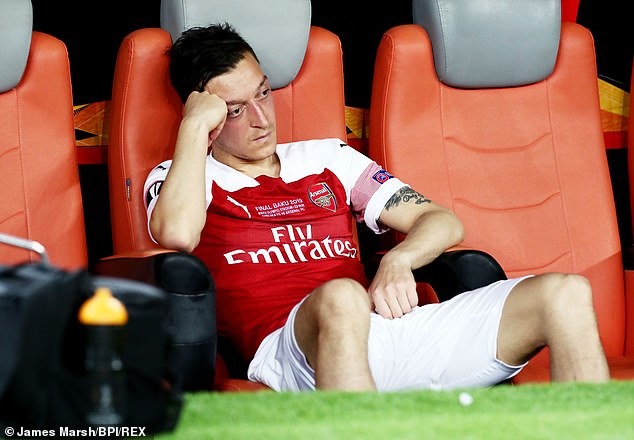 Ozil đã không còn là chính mình. Ảnh: REX.