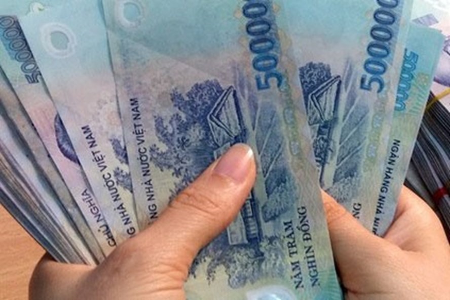 Bộ Tài chính đang lấy ý kiến để điều chỉnh mức giảm trừ gia cảnh từ 9 triệu lên 11 triệu đồng mỗi tháng. Ảnh TL