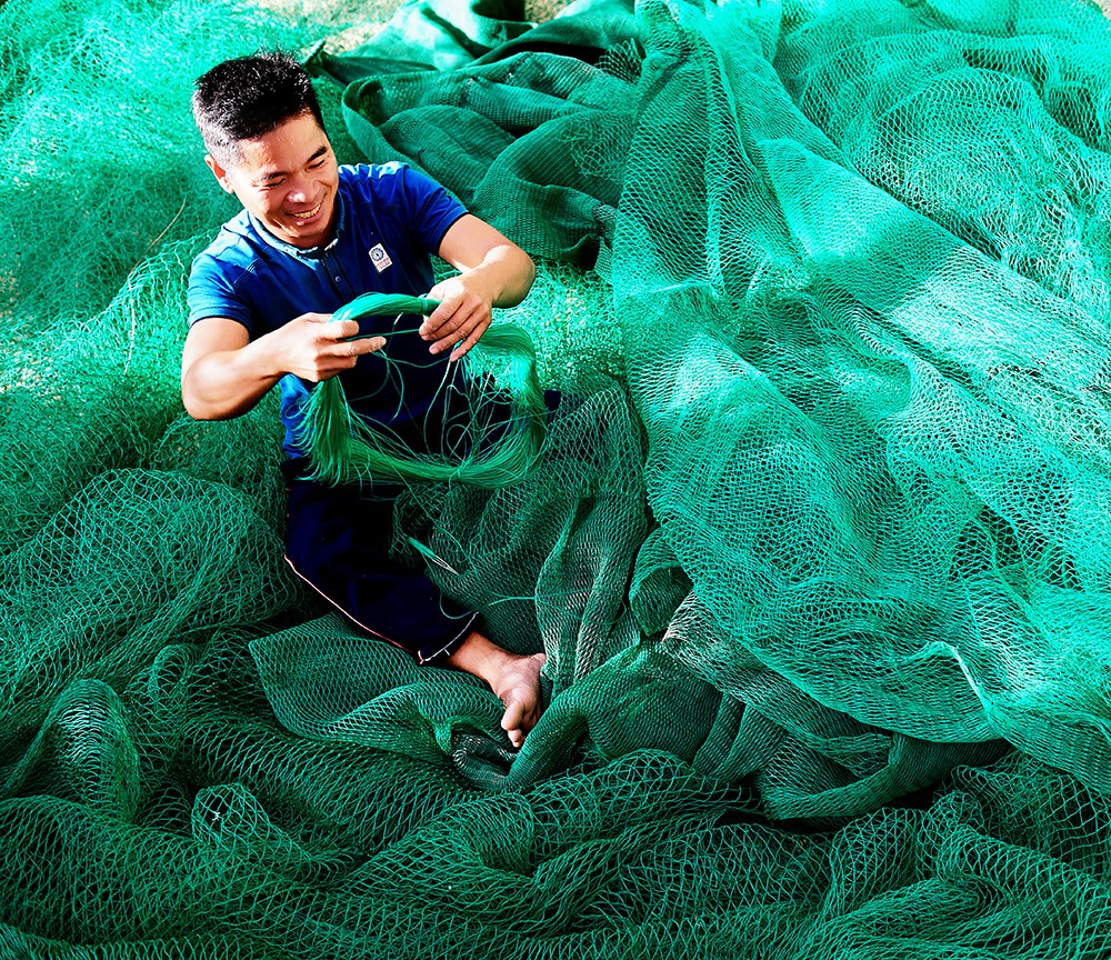 Nụ cười ngư dân (anh Lê Nam - một ngư dân ở làng chài Xuân Hải, Phú Yên).
