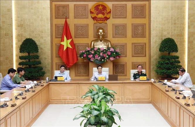 Phó Thủ tướng Vũ Đức Đam, Trưởng Ban Chỉ đạo quốc gia về phòng, chống dịch COVID-19 chủ trì cuộc họp. Ảnh: Dương Giang/TTXVN