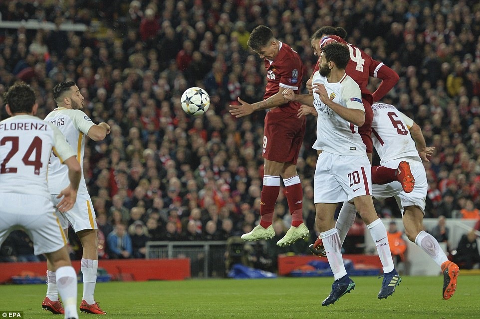 Firmino (áo đỏ bên trái) trong pha đánh đầu đưa tỷ số trận đấu lên 5-0. Ảnh: EPA.