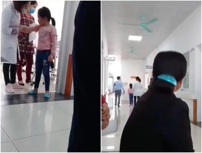 Bé gái vẫn bị bố quát mắng sau khi đã lấy máu xét nghiệm xong - Ảnh cắt từ clip