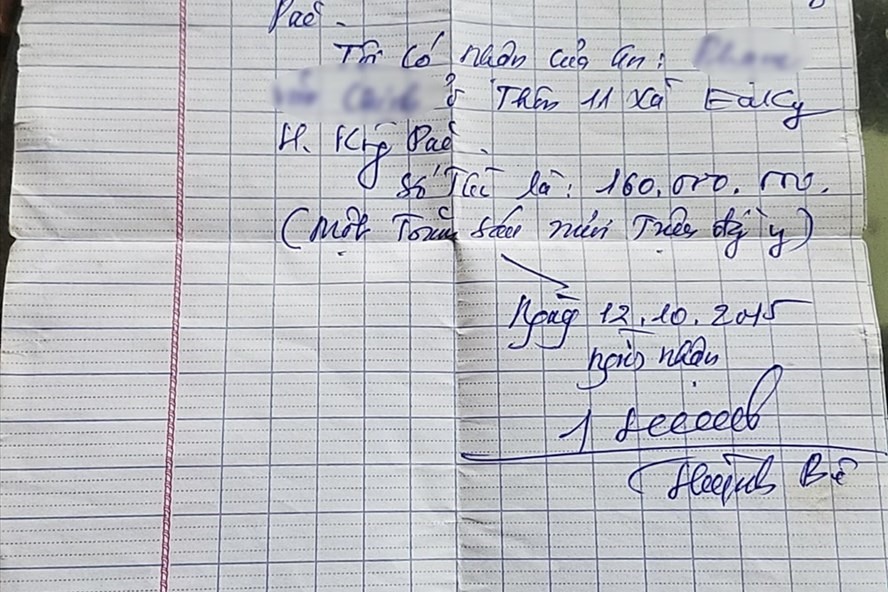 Giấy tờ nhận tiền viết tay có chữ ký của ông Huỳnh Bê.