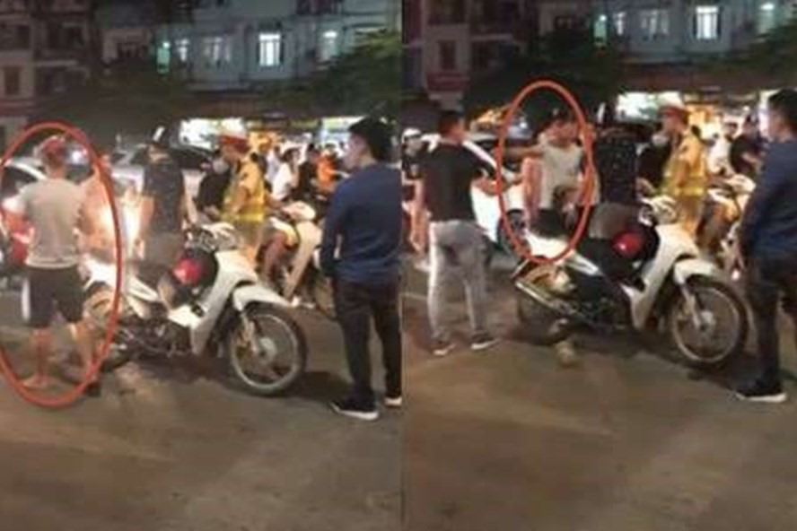 Hình ảnh clip ghi lại vụ việc cô gái bức xúc yêu cầu 2 thanh niên xin lỗi.